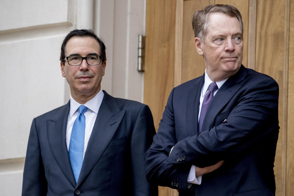 Treasury Secretary Steve Mnuchin, left, and United States Trade Representative Robert Lighthizer, right, wait for Chinese Vice Premier Liu He to arrive outside the Office of the United States Trade Representative in Washington, Friday, May 10, 2019 for trade talks between the United States and China. (AP Photo/Andrew Harnik)