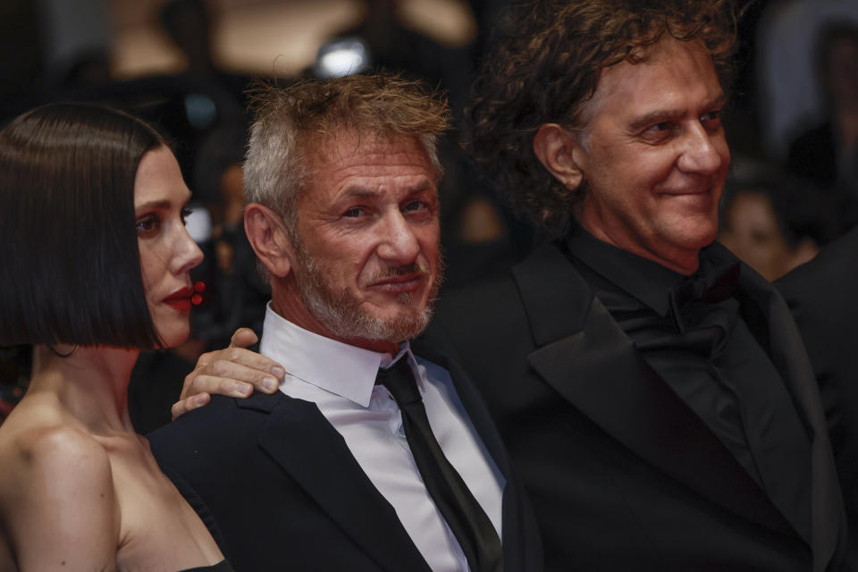 Raquel Nave, from left, Sean Penn, and Jean-Stephane Sauvaire pose for photographers upon arrival at the premiere of the film 'Black Flies' at the 76th international film festival, Cannes, southern France, Thursday, May 18, 2023. (Photo by Joel C Ryan/Invision/AP)