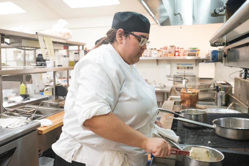 Student chef Ximena Gastelum warms up a soup dish in the Rancho Cielo kitchen.