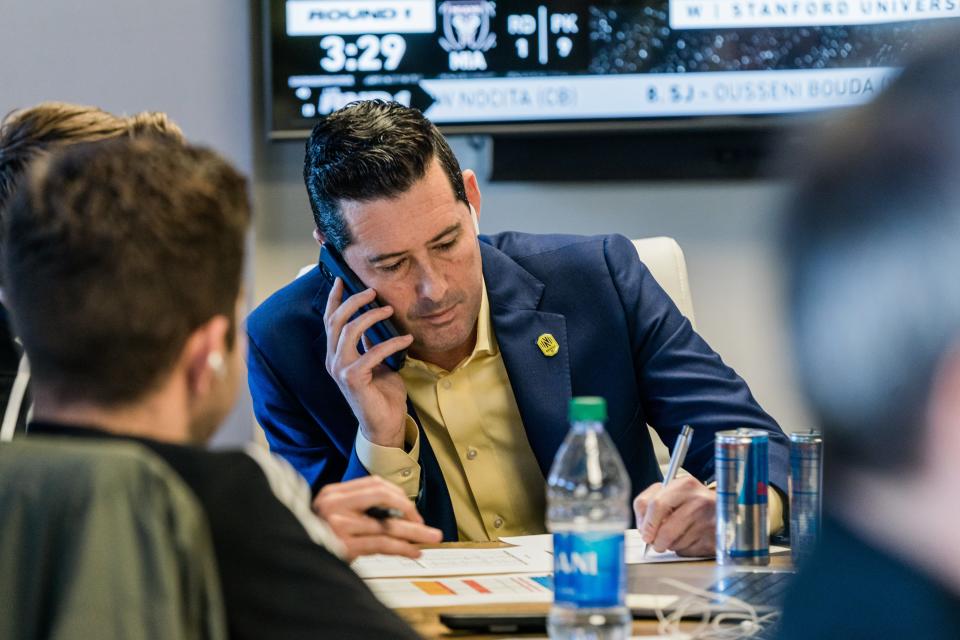 Nashville SC general manager Mike Jacobs speaks on the phone during the 2022 MLS SuperDraft, selecting UCLA's Ahmed Longmire with the 10th overall pick. Nashville, Tenn. Jan. 11, 2022.