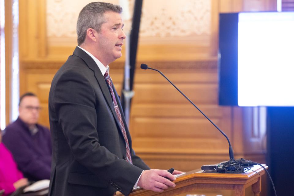 Kansas budget director Adam Proffit presents Gov. Laura Kelly's budget proposal at Thursday's hearing in the Statehouse.