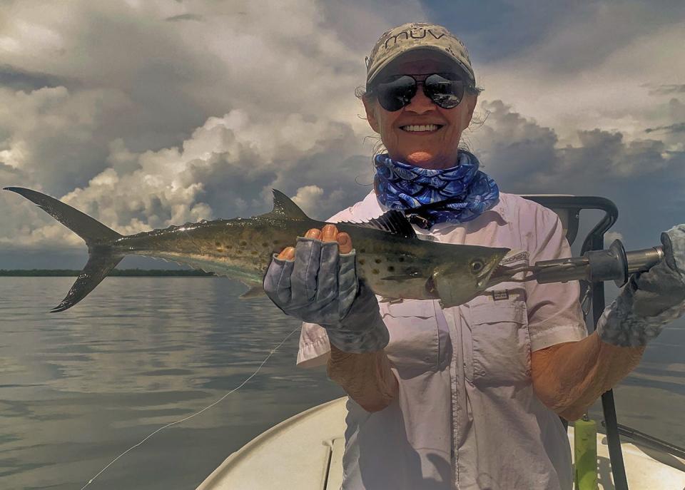 Pat Beckwith of Sarasota with a Spanish mackerel caught on a fly while fishing Sarasota Bay with Capt. Rick Grassett recently. 