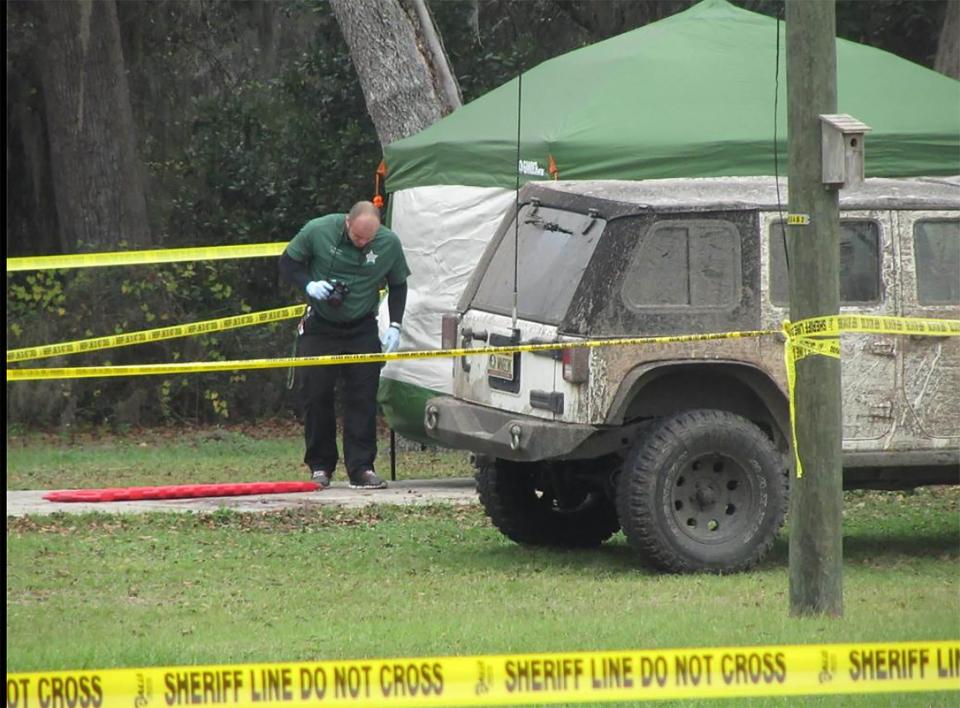 This file photo shows a crime scene technician working where Ronnie Damon was killed in January 2016.