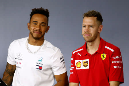 Formula One F1 - Australian Grand Prix - Melbourne Grand Prix Circuit, Melbourne, Australia - March 22, 2018 Mercedes' Lewis Hamilton and Ferrari's Sebastian Vettel during the press conference REUTERS/Brandon Malone