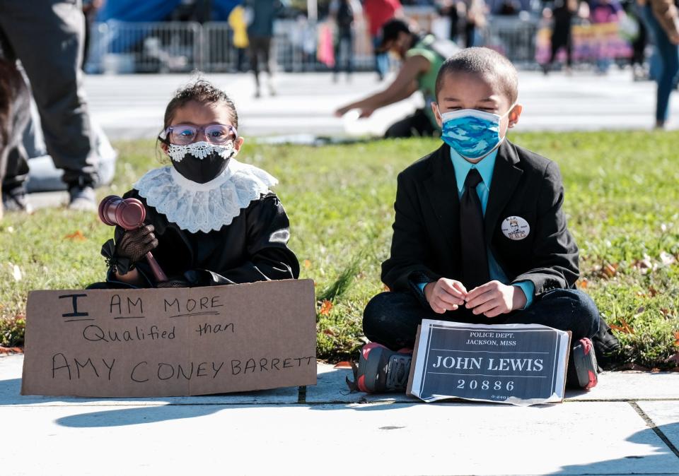 A child dressed up as RBG