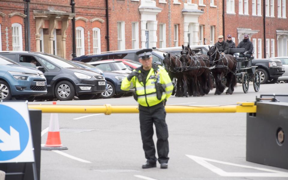 The Duke of Edinburgh was also seen driving his carriage behind security barriers while a police stood guard - Credit: Paul Grover for the Telegraph
