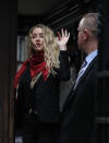 Actress Amber Heard, center, arrives at the High Court in London, Thursday, July 16, 2020. Actor Johnny Depp is suing News Group Newspapers, publisher of The Sun, and the paper’s executive editor, Dan Wootton, over an April 2018 article that called him a “wife-beater.” The Sun’s defense relies on a total of 14 allegations by Heard of Depp’s violence. He strongly denies all of them. (AP Photo/Alastair Grant)