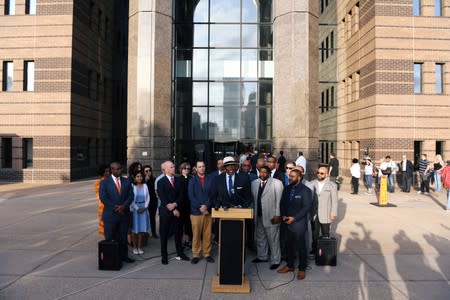 Dr. Michael Waters from the Joy Tabernacle A.M.E. Church speaks at the prayer vigil held outside the Frank Crowley Courts Building on the first day of the trial against former police officer Amber Guyger in Dallas