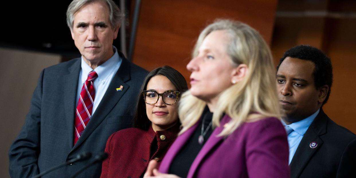 Democratic Rep. Abigail Spanberger of Virginia speaks at an April 2022 press conference about banning members of Congress from trading stocks as fellow lawmakers look on.