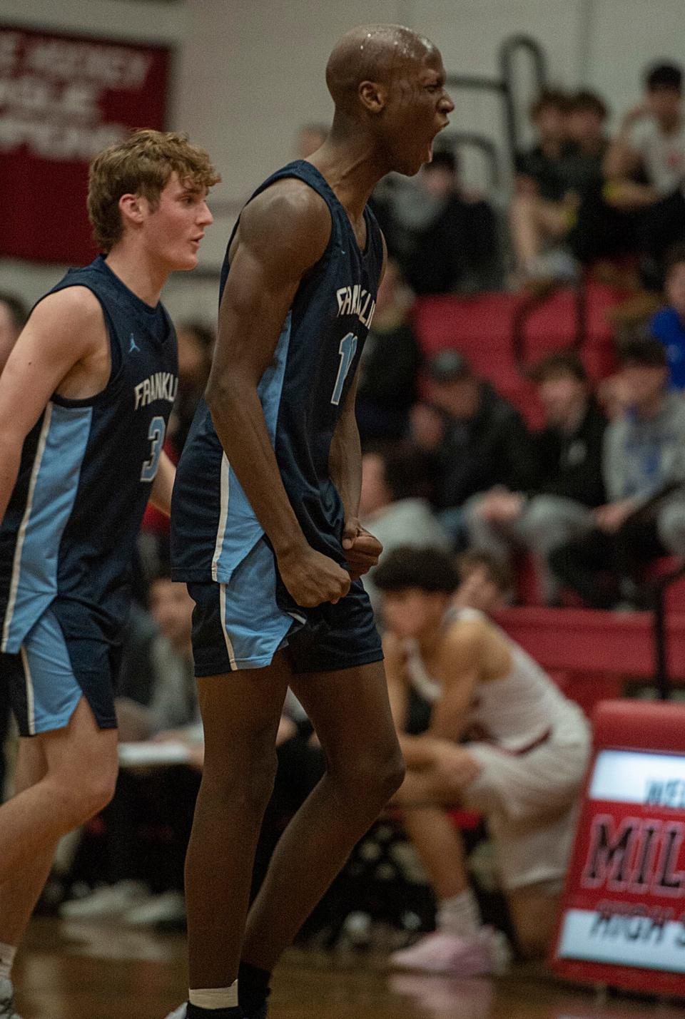 Franklin High School junior Hansy Jacques reacts after scoring against Milford, Feb. 17, 2023.