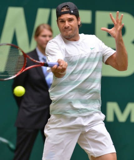 Germany's Tommy Haas returns a ball to his compatriot Philipp Kohlschreiber during their semi-final match of the ATP Gerry Weber Open tennis tournament in Halle, western Germany. Haas won 7-6 (7/5), 7-5