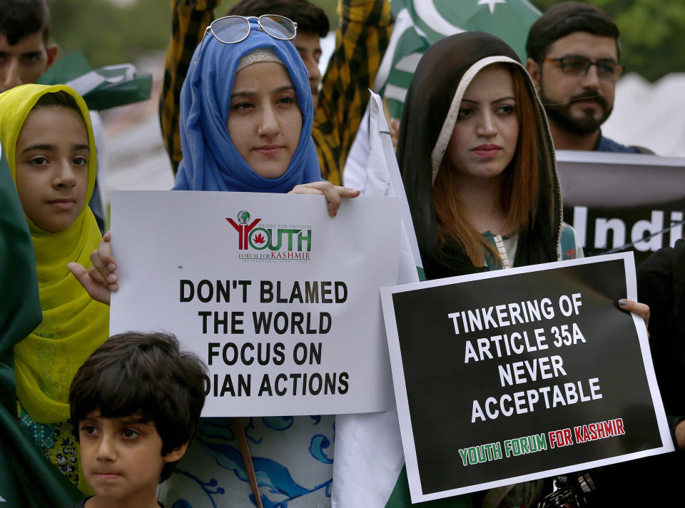 Members of the Youth Forum for Kashmir, a civil society group, attend a demonstration to protest India's policy on Kashmir, in Islamabad, Pakistan, Tuesday, Aug. 6, 2019. Pakistan President Arif Alvi convened his country's parliament to discuss India's surprise actions on Kashmir. (AP Photo/Anjum Naveed)