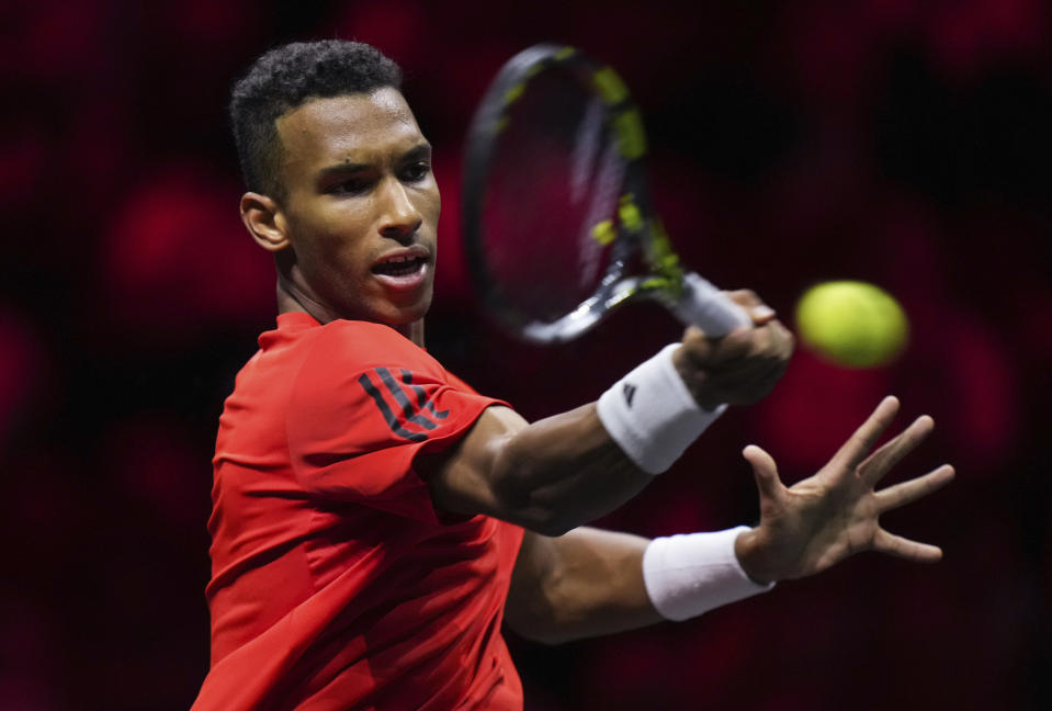 Team World's Felix Auger-Aliassime returns to Team Europe's Gael Monfils during a Laver Cup tennis match Friday, Sept. 22, 2023, in Vancouver, British Columbia. (Darryl Dyck/The Canadian Press via AP)