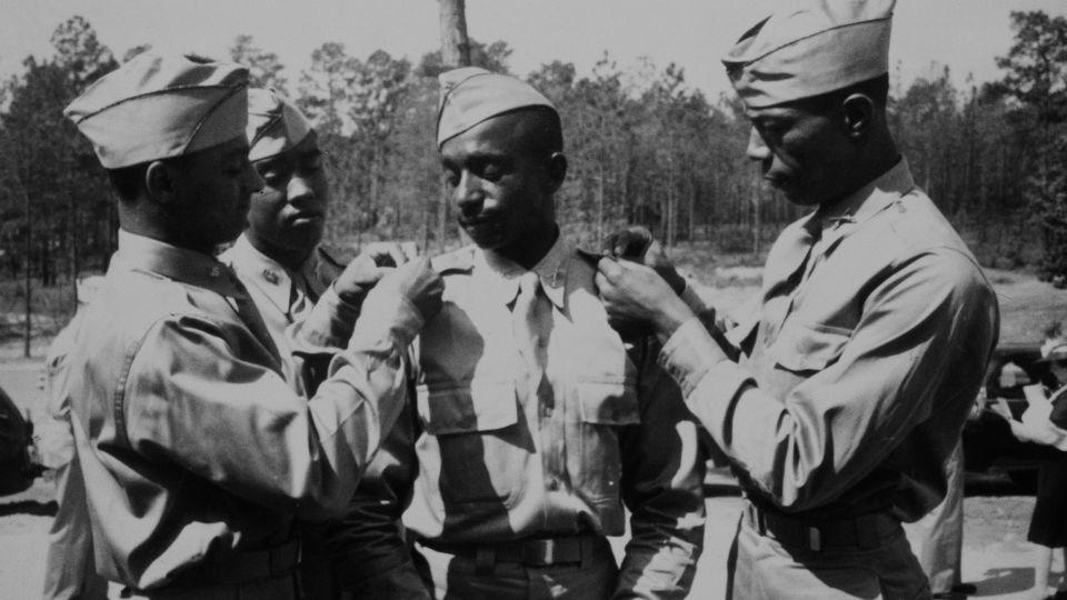 Training for Black US Army officers was integrated in the early 1940s. Military officers (from left) 2nd Lt. Henry C. Harris, Jr., 2nd Lt. Rogers H. Beardon, 2nd Lt. Frank Frederick Doughton and 2nd Lt. Elmer B. Kountze are seen following graduation at Fort Benning in Georgia, May 29, 1942. - Archive Photos/Getty Images