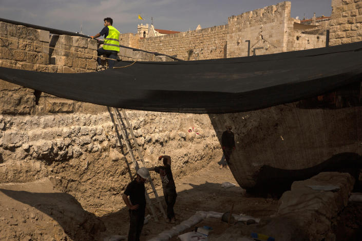 Workers on a construction site inside the Tower of David Museum in the Old City of Jerusalem, Wednesday, Oct. 28, 2020. Jerusalem's ancient citadel is devoid of tourists due to the pandemic and undergoing a massive restoration and conservation project. (AP Photo/Maya Alleruzzo)