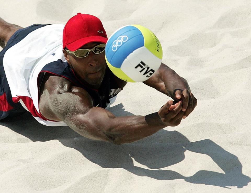The United States' Dain Blanton makes a dig during a match against Switzerland at the 2004 Olympic Games