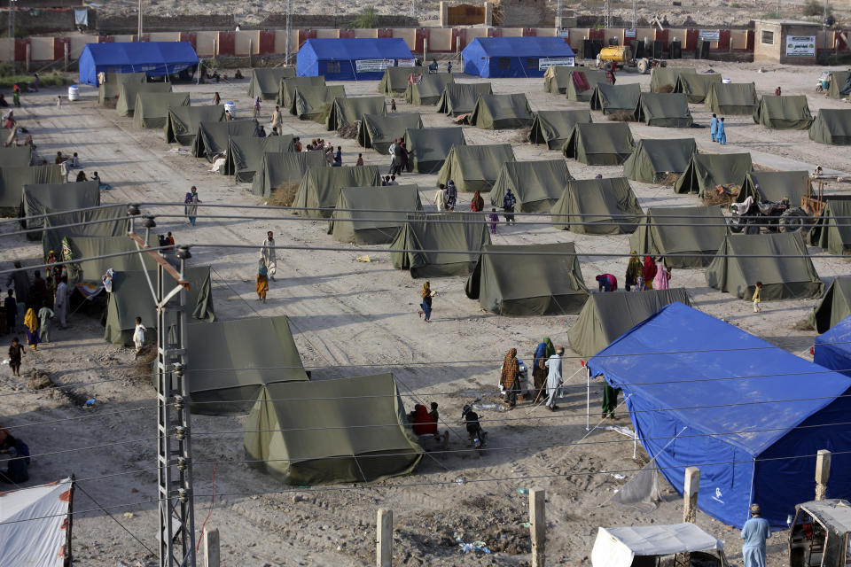 Temporary housing is constructed for flood victims organized by the China government, in Sukkur, Pakistan, Wednesday, Sept. 7, 2022. (AP Photo/Fareed Khan)