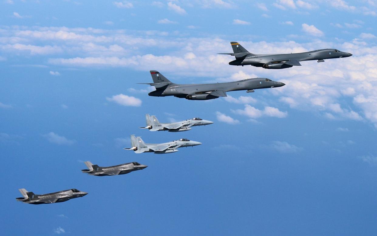 US stealth fighters fly beside B-1B bombers over waters near Kyushu, Japan, on 31 August. - JAPAN AIR SELF-DEFENSE FORCE VIA