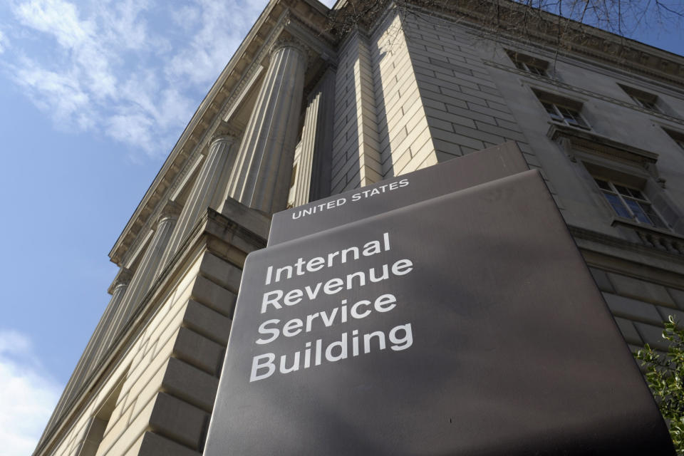 FILE - Outside the Internal Revenue Service (IRS) in Washington, March 22, 2013. In an effort to stop personal threats against IRS employees, the agency says it will begin limiting workers& #x002019;  personal identification information on communications with taxpayers.  (AP Photo/Susan Walsh, File)