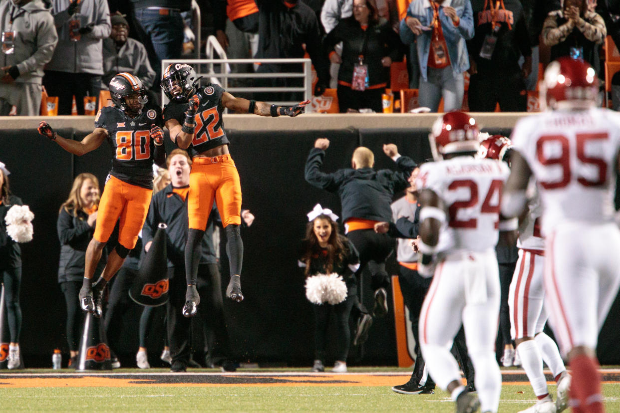 STILLWATER, OK - NOVEMBER 27: Oklahoma State Cowboys wide receiver Brennan Presley (80) and [os22o[ celebrate in the end zone after a play against the Oklahoma Sooners on November 27th, 2021 at Boone Pickens Stadium in Stillwater, Oklahoma. (Photo by William Purnell/Icon Sportswire via Getty Images)