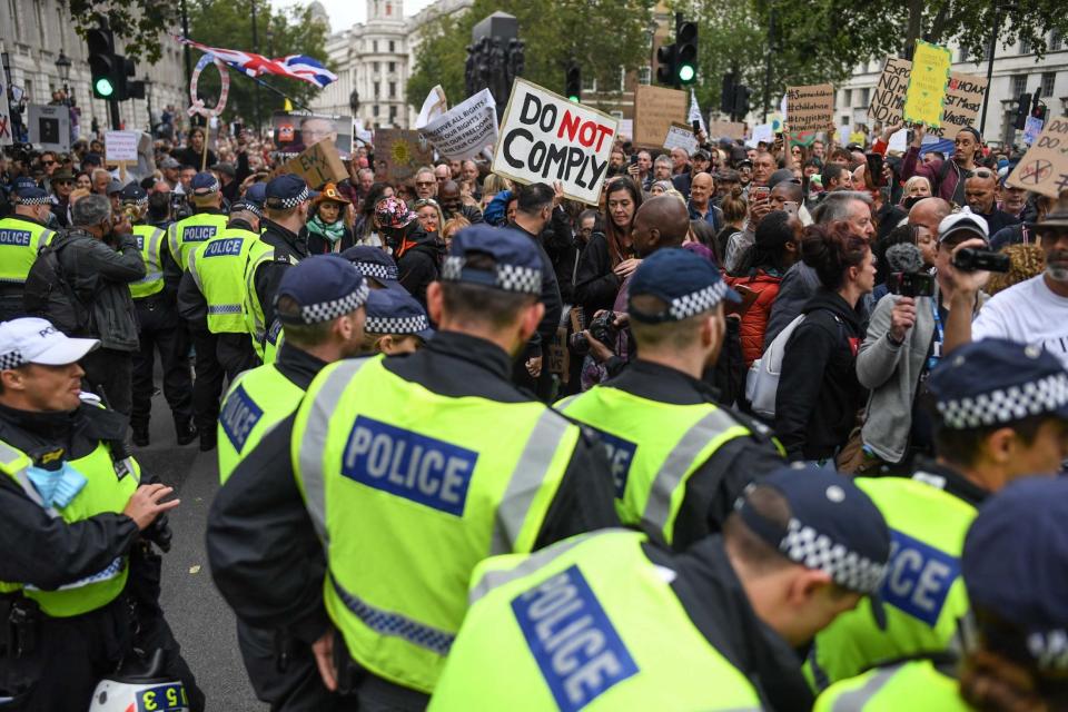 Police confronted the hoards of anti-mask demonstrators (Getty Images)