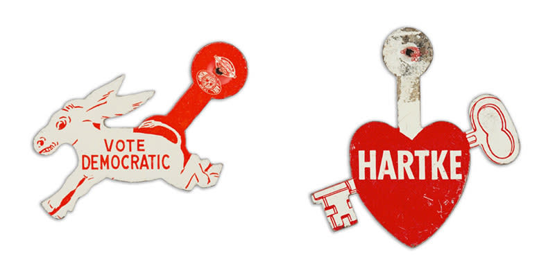 A button in the shape of a donkey reads "vote democratic" and a button outlined with a heart and a key going through it reads the name "Hartke"