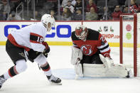 New Jersey Devils goaltender Mackenzie Blackwood (29) stops a shot by Ottawa Senators left wing Tim Stutzle (18) during the second period of an NHL hockey game Monday, Dec. 6, 2021, in Newark, N.J. (AP Photo/Bill Kostroun)