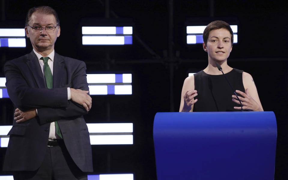 Co-Presidents of the Greens/EFA Group, Philippe Lamberts, left, and Ska Keller, right, speak in the hemicycle of the European Parliament in Brussels, Sunday, May 26, 2019. From Germany and France to Cyprus and Estonia, voters from 21 nations went to the polls Sunday in the final day of a crucial European Parliament election that could see major gains by the far-right, nationalist and populist movements that are on the rise across much of the continent. (AP Photo/Olivier Matthys)