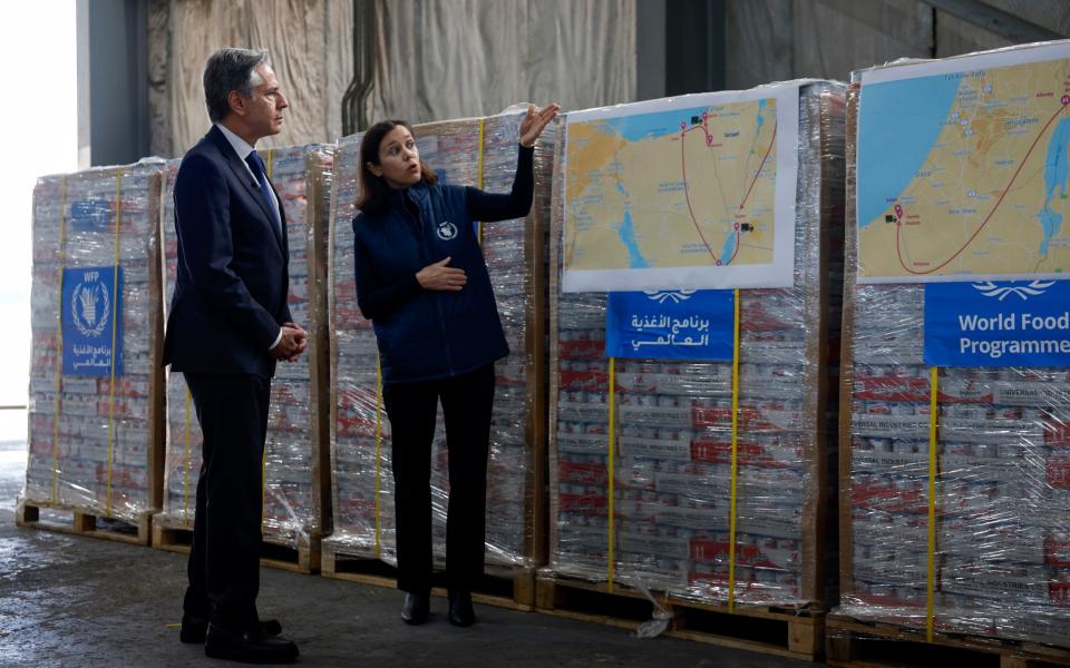 Mr Blinken visits a World Food Program regional warehouse in Amman