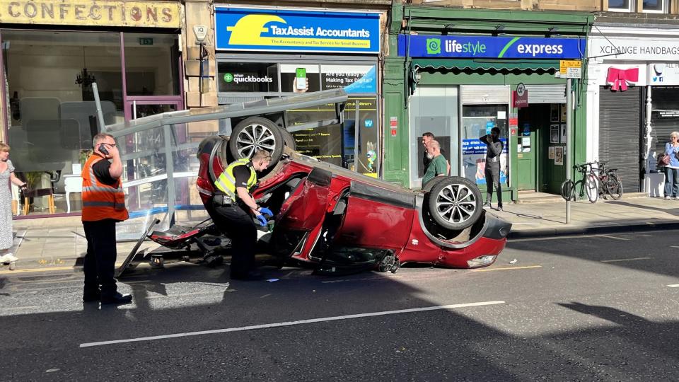 The driver of the Nissan was trapped inside the car after the crash in Edinburgh's Inverleith Row.  Picture: Ian McAteer.