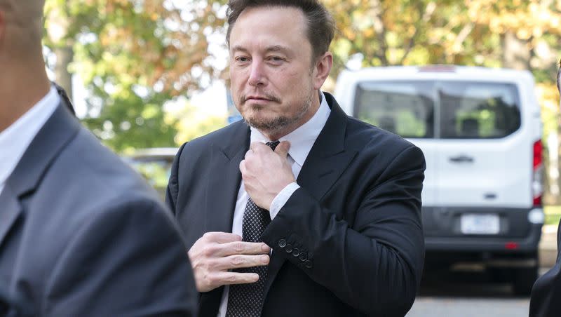 Elon Musk, CEO of X, the company formerly known as Twitter, tightens his tie as he arrives for a closed-door gathering of leading tech CEOs to discuss the priorities and risks surrounding artificial intelligence and how it should be regulated, at Capitol Hill in Washington, Wednesday, Sept. 13, 2023.