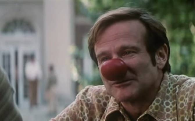 Patch Adams with a clown nose on his face in "Patch Adams"