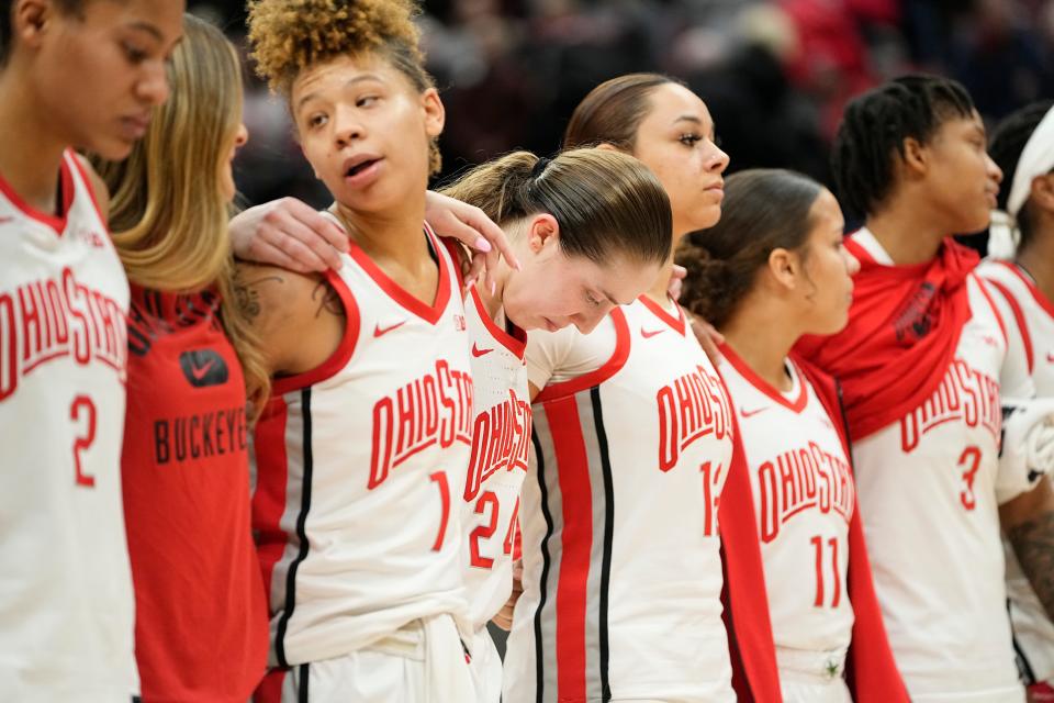 Jan 23, 2023; Columbus, OH, USA;  Ohio State Buckeyes guard Taylor Mikesell (24) hangs her head during &quot;Carmen Ohio&quot; following the NCAA women's basketball game against the Iowa Hawkeyes at Value City Arena. Ohio State lost 83-72. Mandatory Credit: Adam Cairns-The Columbus Dispatch