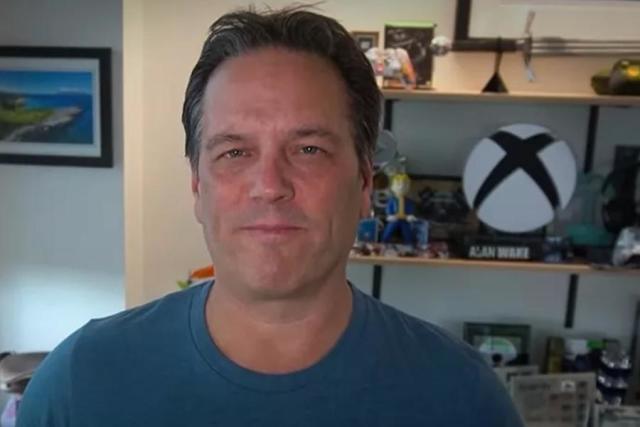 Players joke about Phil Spencer in a suit, and he himself finds it
