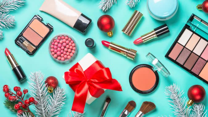 Christmas flat lay background with Makeup product, professional cosmetics on mint.