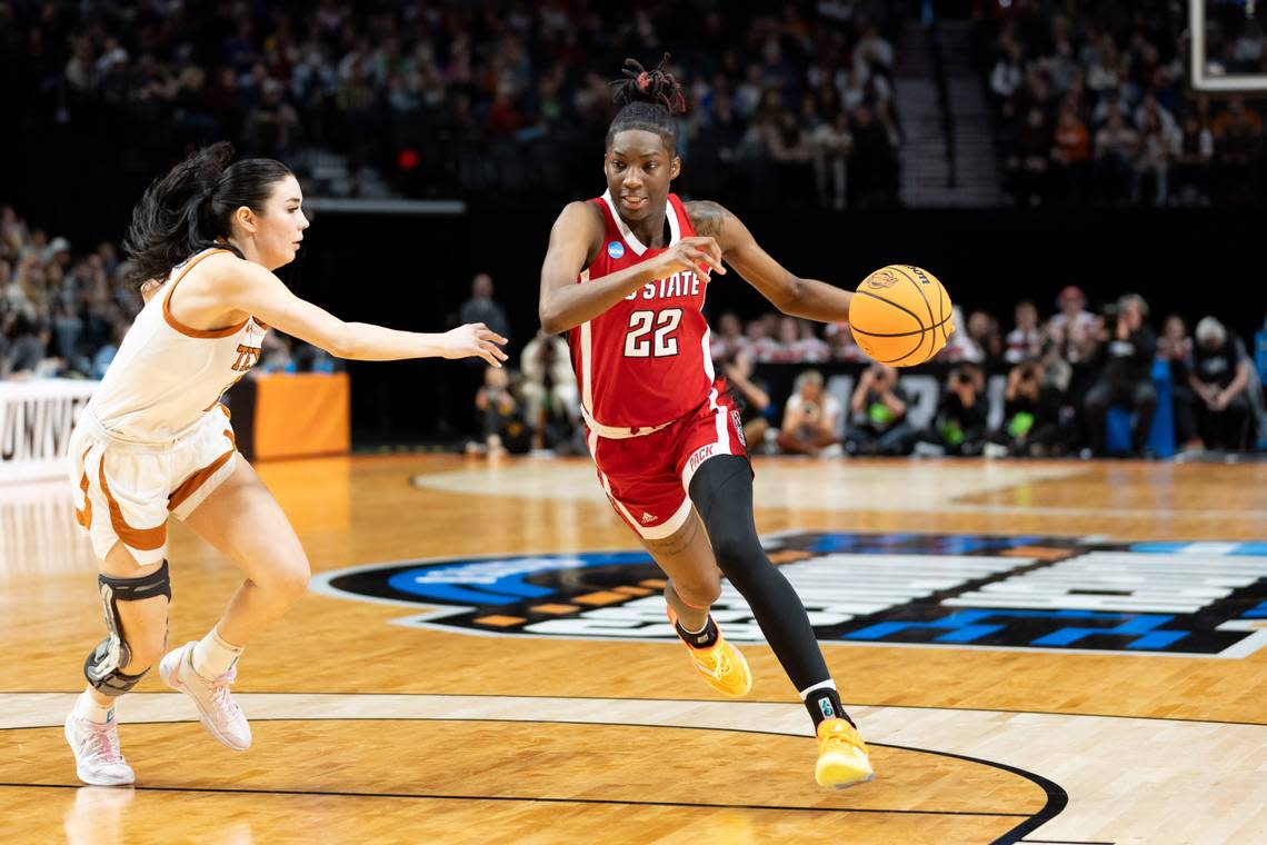 NC State’s Saniya Rivers drives against a Texas defenders during their NCAA Tournament Elite 8 game in Portland, Sunday, March 31, 2024.