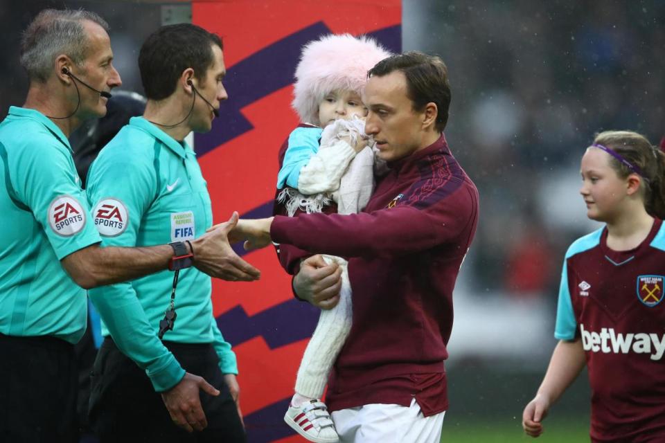 Mark Noble of West Ham United holds Isla Caton at West Ham v Bournemouth earlier this month (Getty Images)