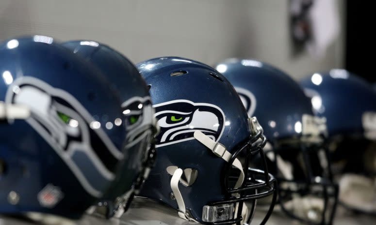 Seattle Seahawks helmets on the sideline.