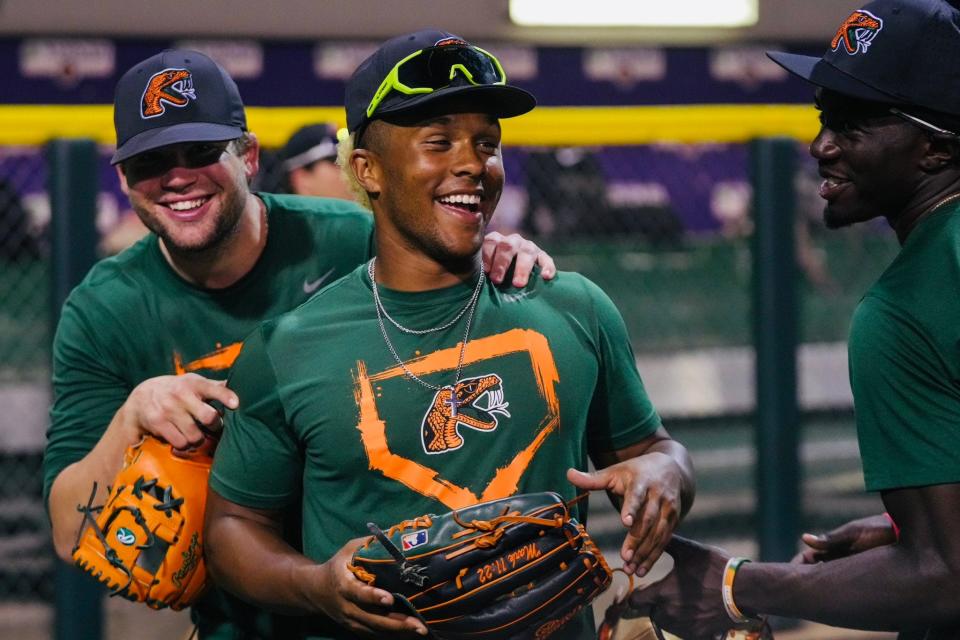 Florida A&M baseball outfielder Ty Jackson (middle) laughs with teammates during a practice before the Andre Dawson Classic at Maestri Field in New Orleans, Louisiana