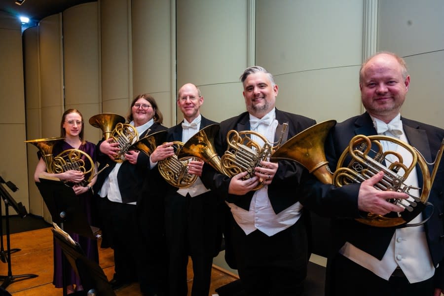 Zyla, second from right, with the horn section of the QCSO at a recent concert.