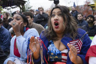 Fans of the United States soccer team Eesha Pendharkar, right, and Dania Abdalla react as they watch on television at a bar in Washington the United States team play against the Netherlands during their World Cup soccer match, Saturday, Dec. 3, 2022. (AP Photo/Manuel Balce Ceneta)