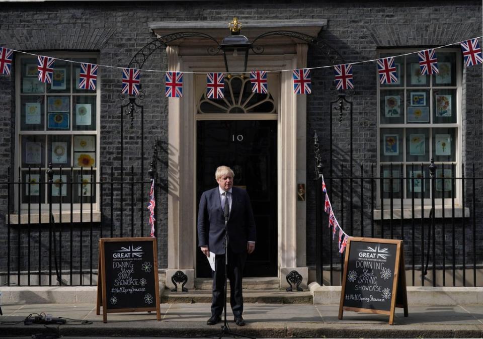 Prime Minister Boris Johnson speaks with stallholders (Victoria Jones/PA) (PA Wire)