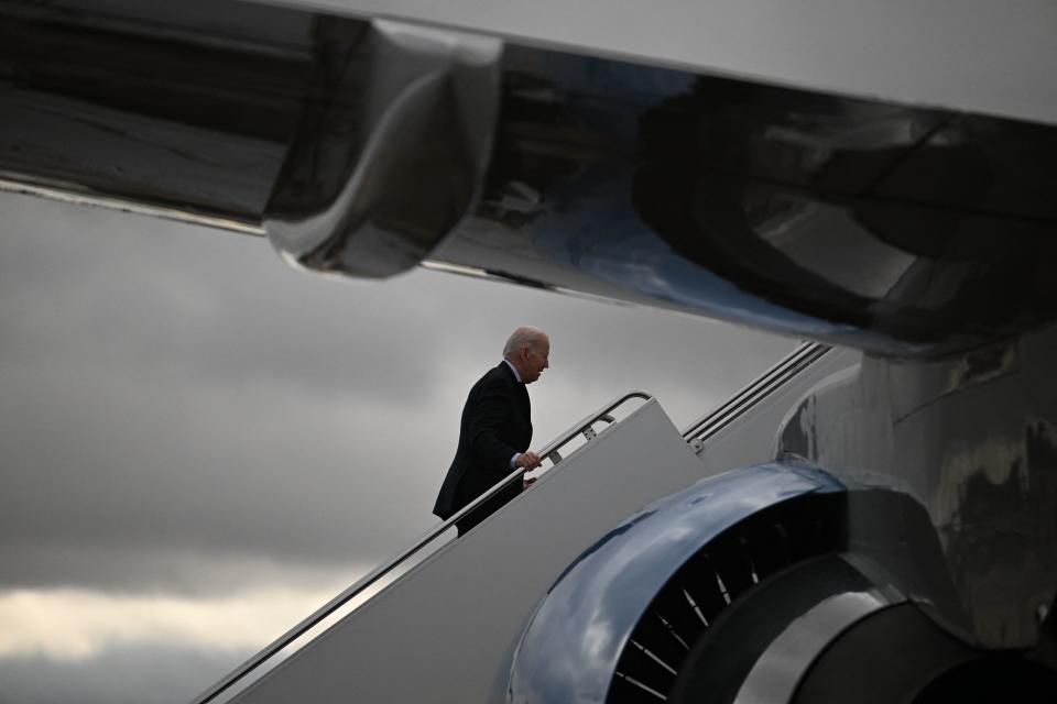 TOP SHOT - U.S. President Joe Biden boards Air Force One as it departs Delaware Air Force National Guard Base in New Castle, Delaware on its way to Washington, D.C., December 16, 2022.  /AFP via Getty Images)