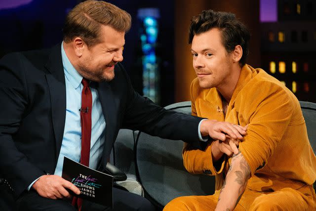 Terence Patrick/CBS Harry Styles shows friend James Corden his 'Late Late' tattoo.