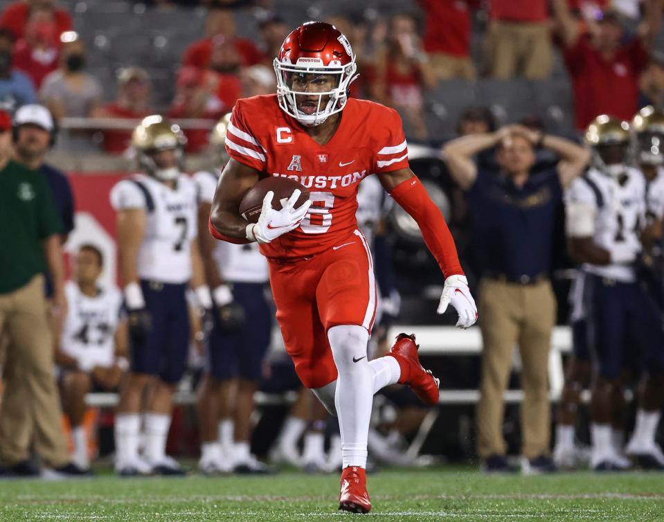 Houston's Marcus Jones returns a punt for a touchdown during a game against the Navy in September. Despite being only 5 feet 8 inches tall, Jones is known for making big plays.