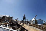 Lynn Ballard, and search dog Toby, of the Boone County, Mo. Urban Search and Rescue team, search rubble in the aftermath of Hurricane Michael in Mexico Beach, Fla., Wednesday, Oct. 17, 2018. (AP Photo/Gerald Herbert)