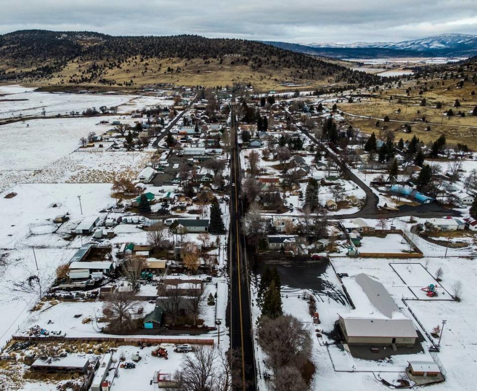 A car drives down Highway 299 in Adin earlier this month.