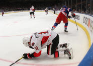 NEW YORK, NY - APRIL 14: Daniel Alfredsson #11 of the Ottawa Senators lays on the ice following an elbow from Carl Hagelin #62 of the New York Rangers that resulted in a major penalty in Game Two of the Eastern Conference Quarterfinals during the 2012 NHL Stanley Cup Playoffs at Madison Square Garden on April 14, 2012 in New York City. Alfredsson left the game following the hit. (Photo by Bruce Bennett/Getty Images)