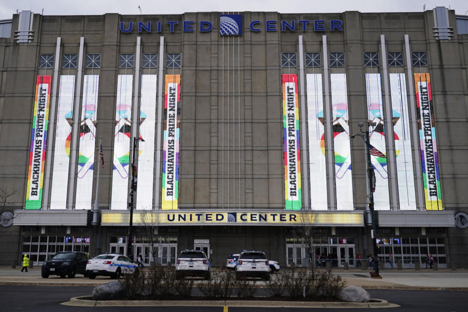 Screens display "Blackhawks Pride Night" outside United Center before an NHL hockey game between the Vancouver Canucks and the Chicago Blackhawks in Chicago, Sunday, March 26, 2023. (AP Photo/Nam Y. Huh)