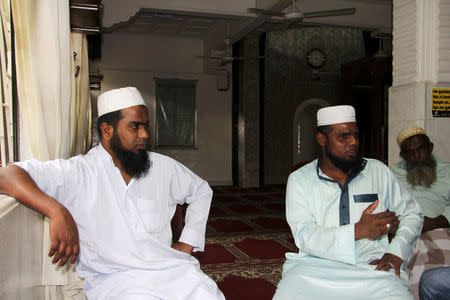 A.H. Ramees (L) and M.S.M Farwin, two Islamic clerics who allege they were beaten by Sri Lankan police inside the Hijrapura Mosque during anti-Muslim riots speak during an interview with Reuters in Digana, Sri Lanka March 16, 2018. REUTERS/Tom Allard